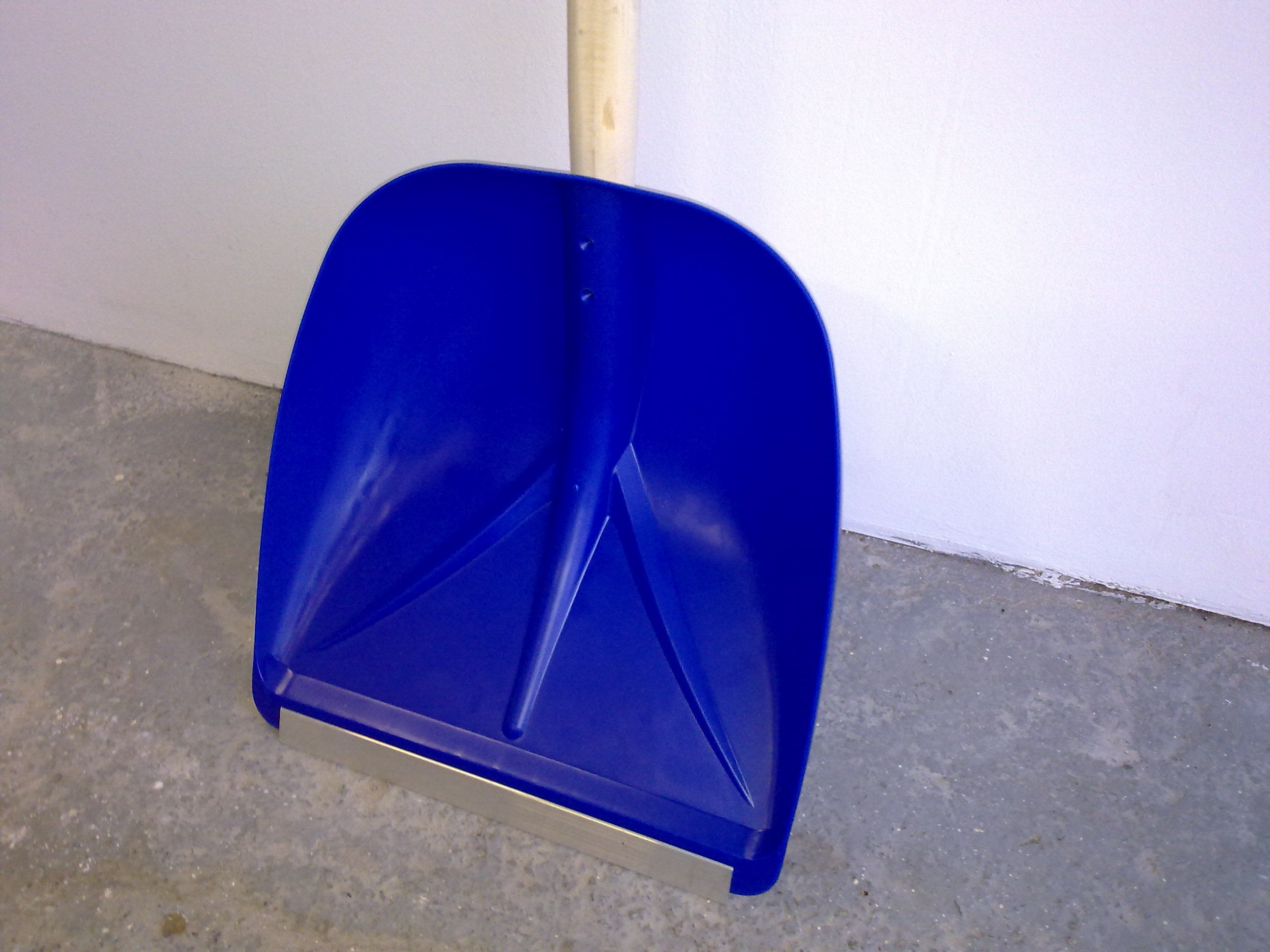 Plastic snow shovel with edge protector