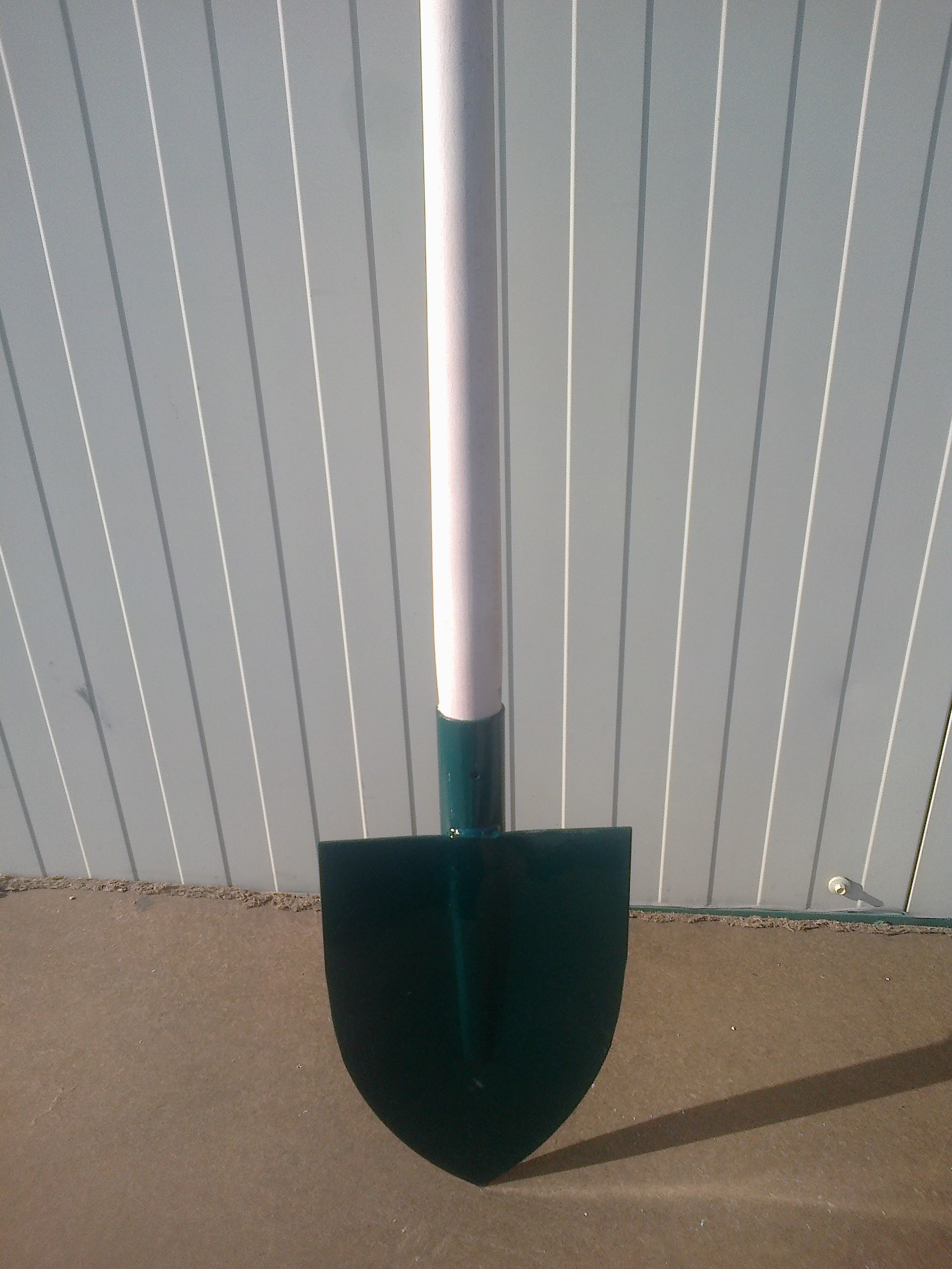 Forged spade with wooden handle